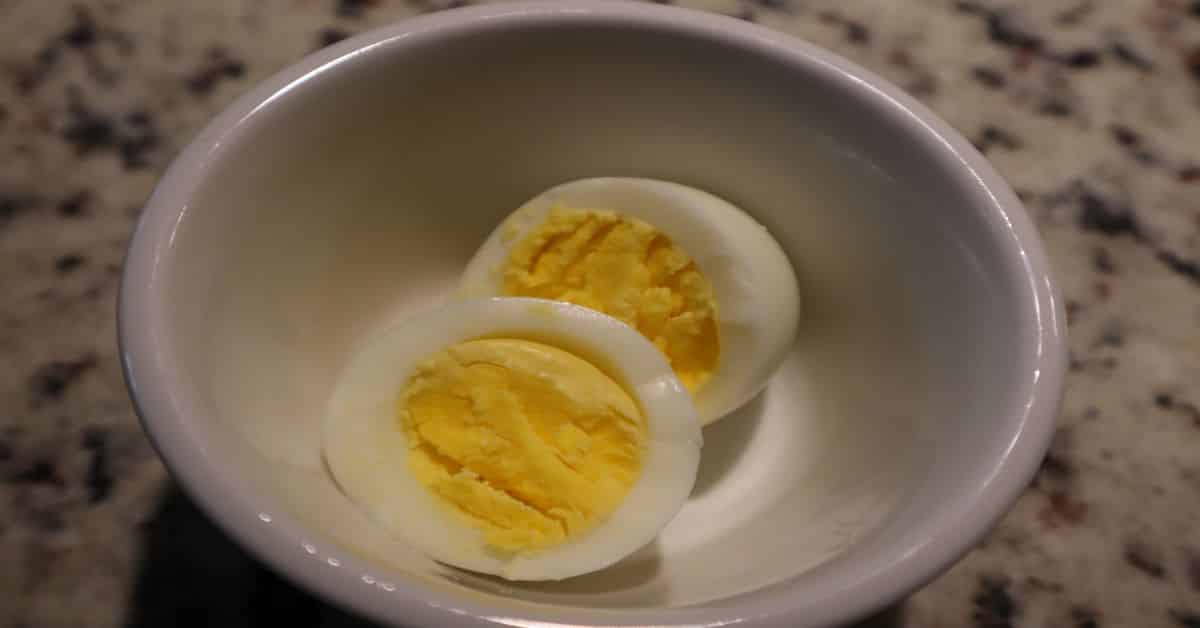 Hard Boiled Egg in white bowl cut in halves