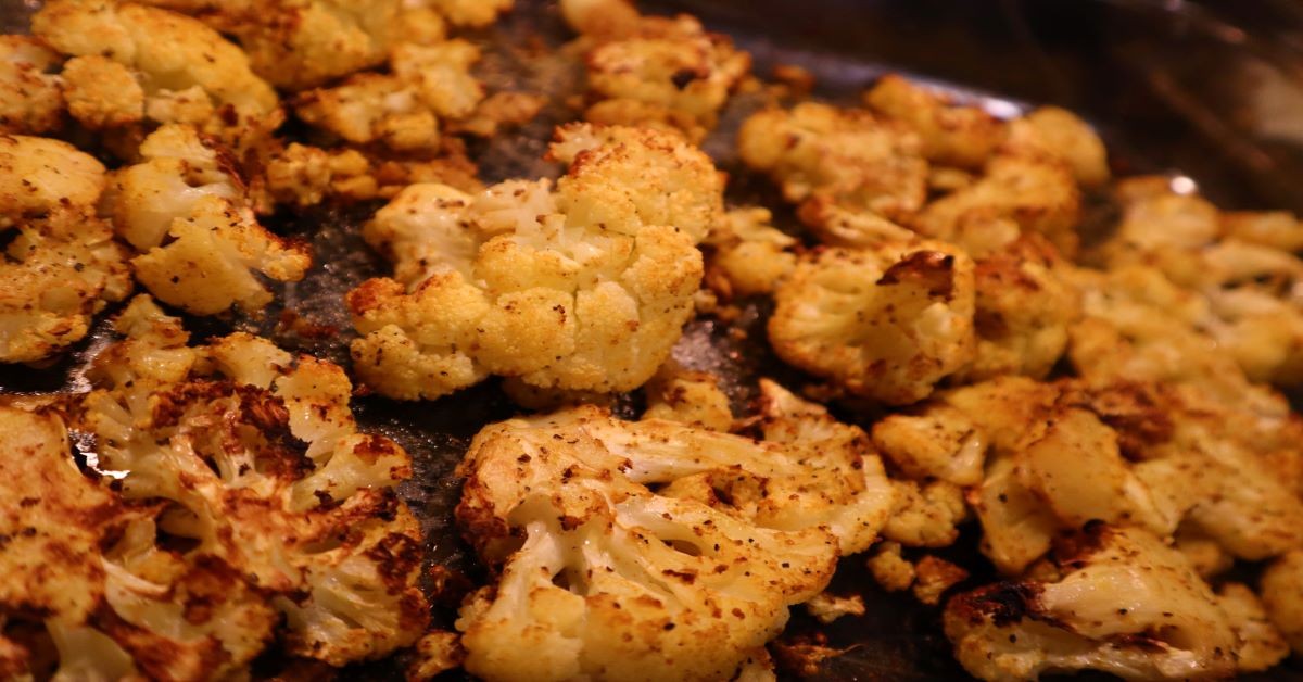 Vegan Low Carb Roasted Cauliflower Recipe made in Oven or Air Fryer in pan after roasting completed