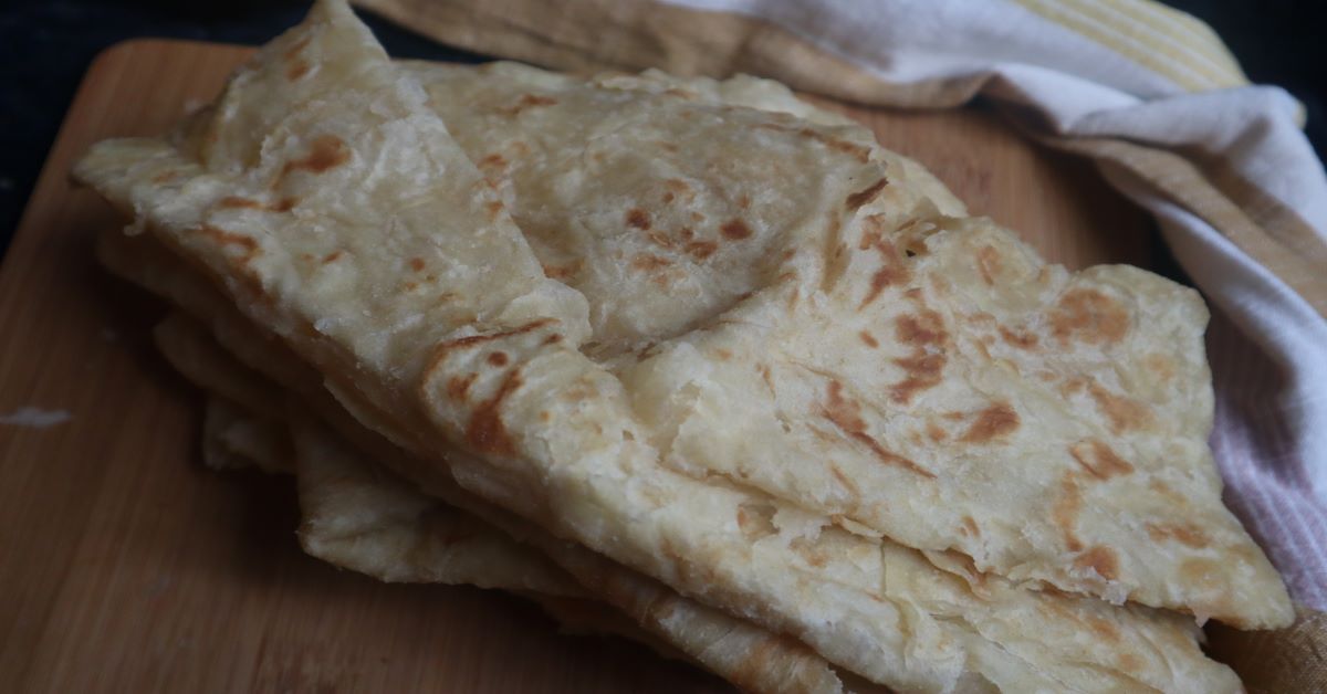 Finished Paratha Roti with a kitchen towel in background