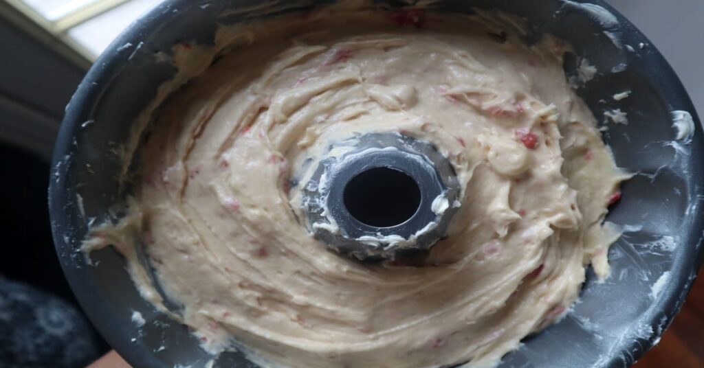 Strawberry champagne pound cake batter in bunt cake pan