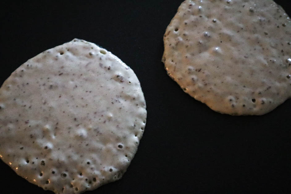 Cooking pancake batter circles on griddle