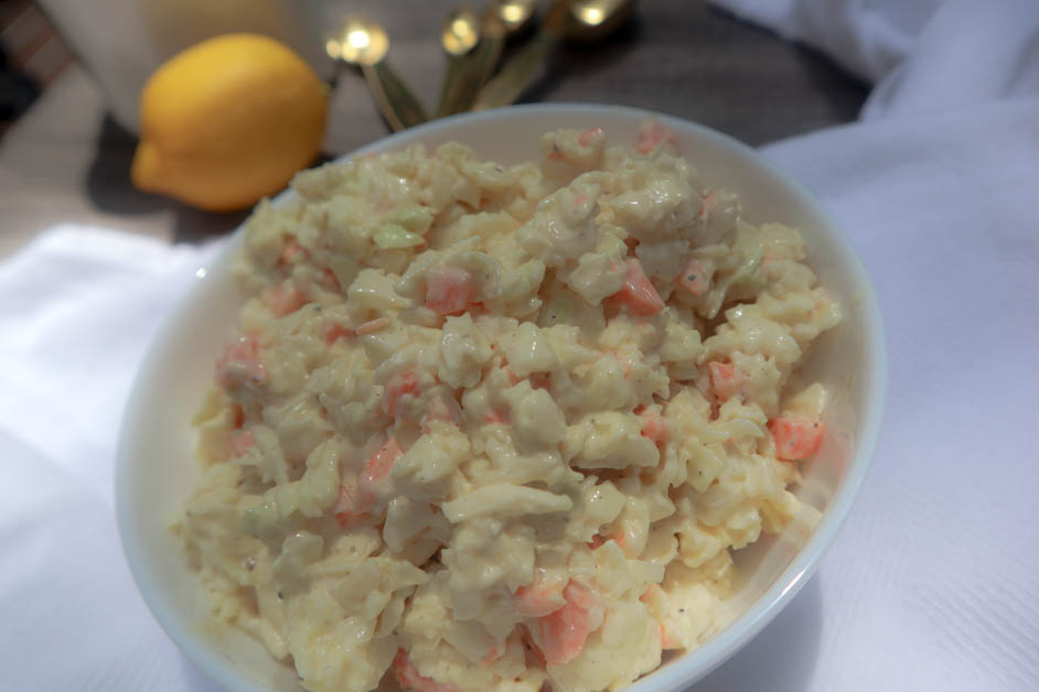 creamy coleslaw in a white bowl